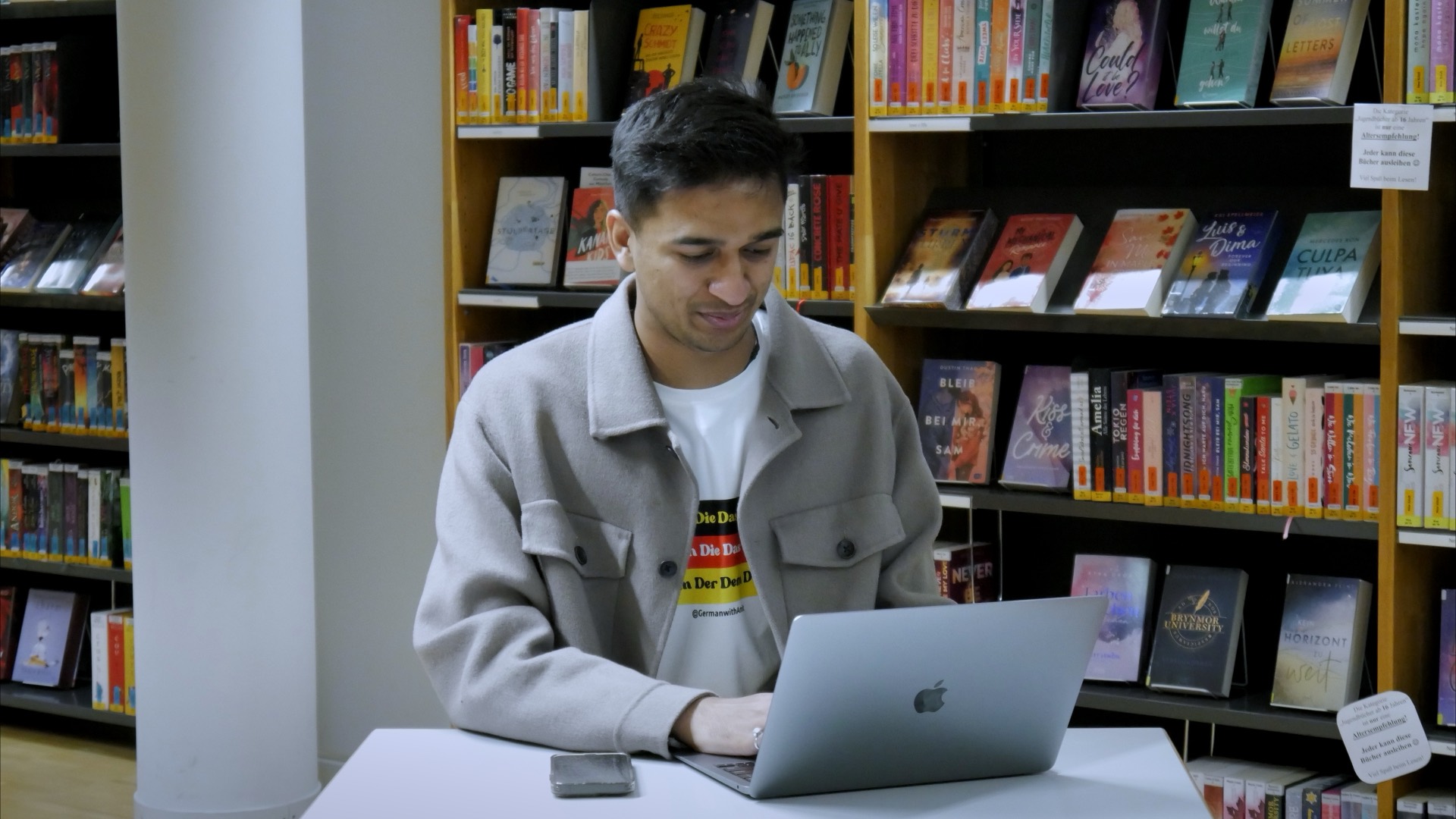 Amit working in a library